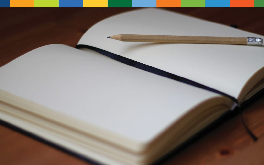 Image of a blank journal with a pencil on top