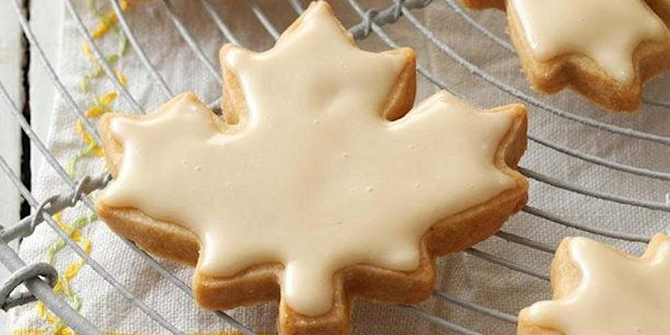 Photo of a maple leaf-shaped cookie with maple icing