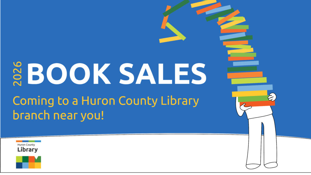 Illustration of a person holding a large stack of books with text promoting 2026 Huron County Library book sales